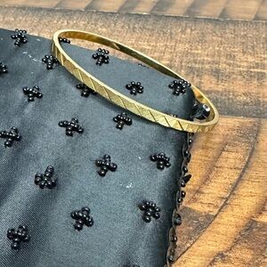 Monet Gold Tone Textured Bangle